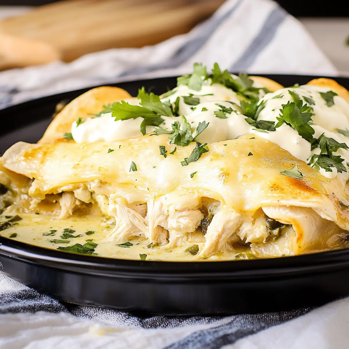 White Chicken Enchiladas with Green Chili Sour Cream Sauce